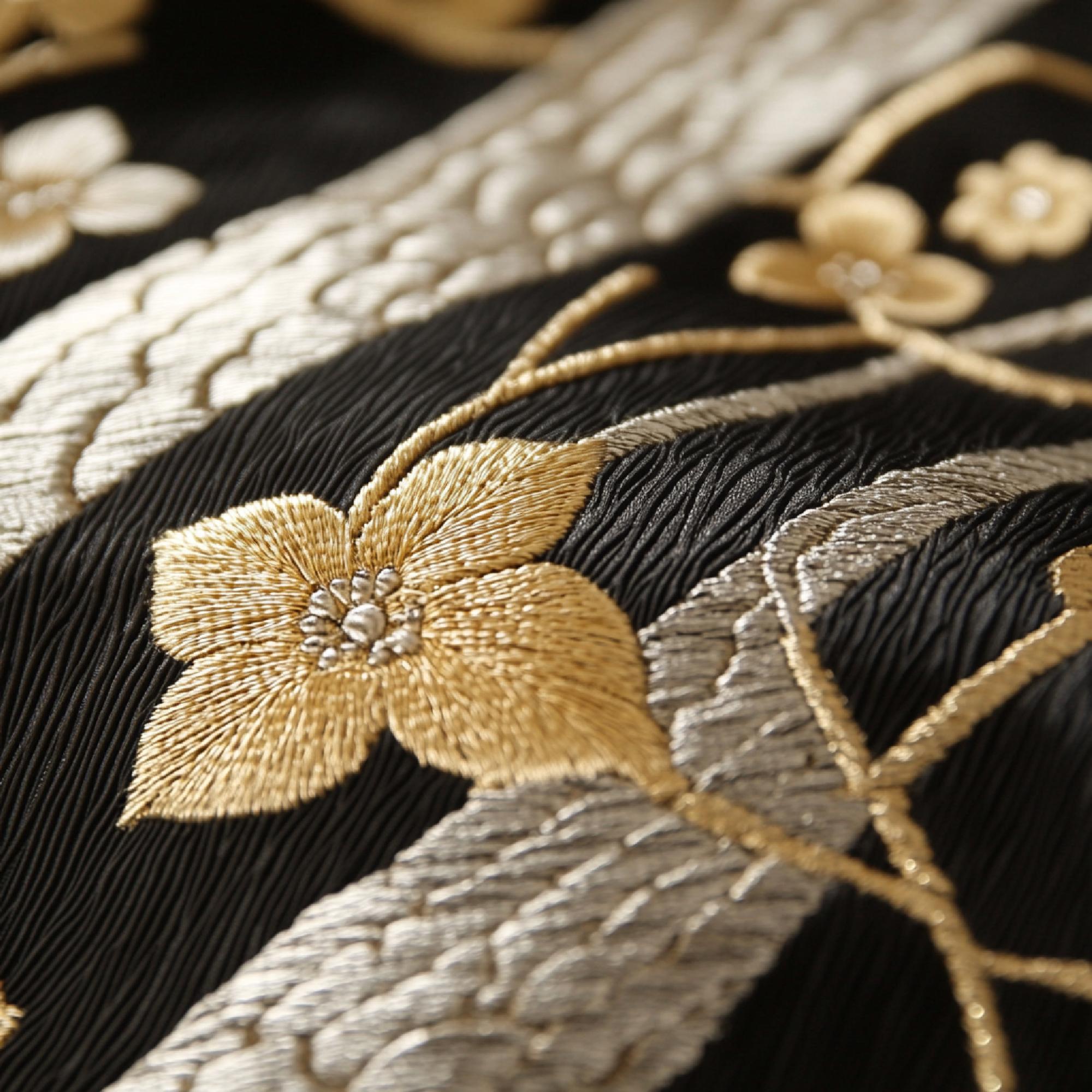 Close detail of gold thread embroidered motif
