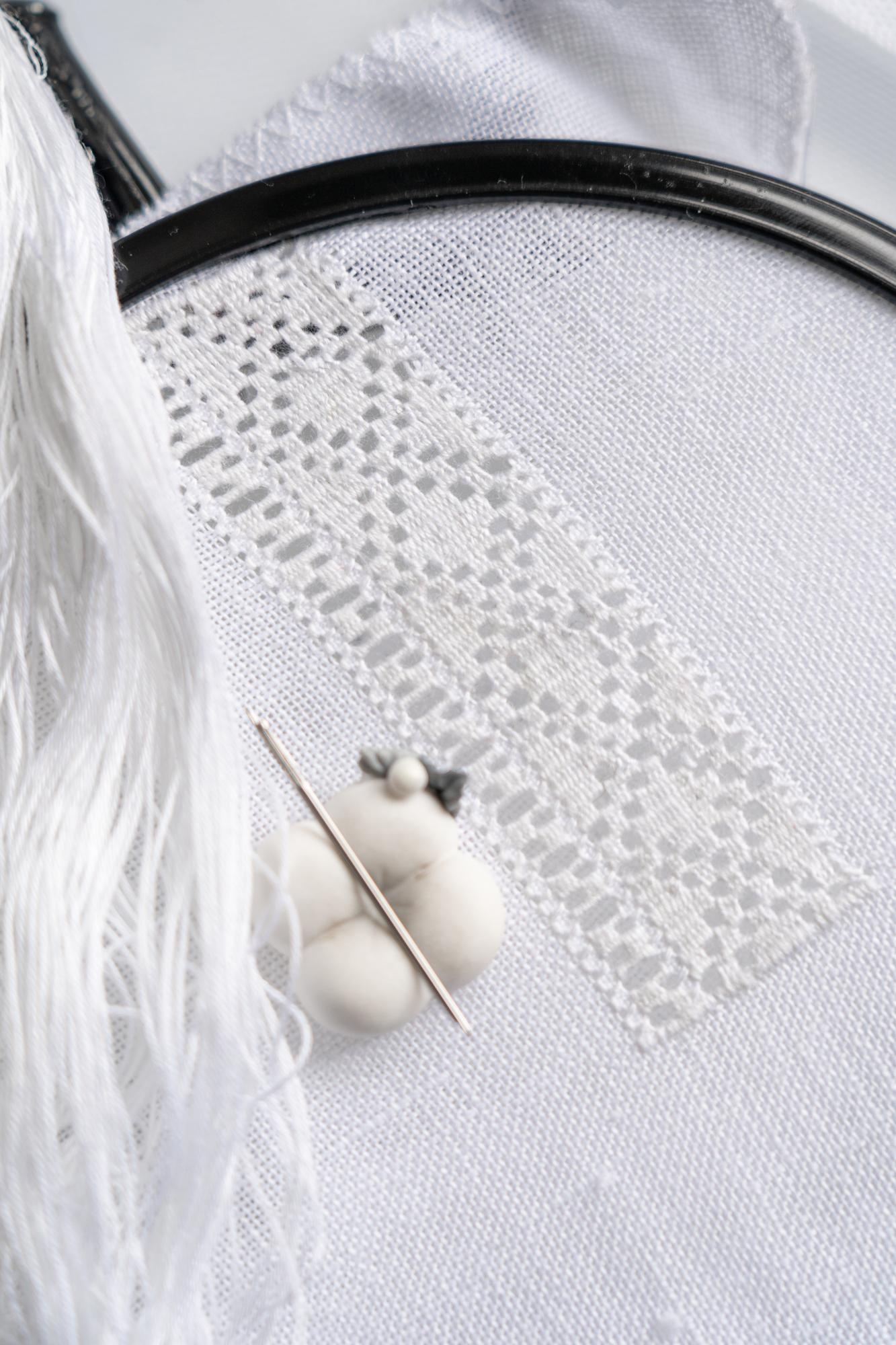 Close-up of luxury hand embroidery on linen